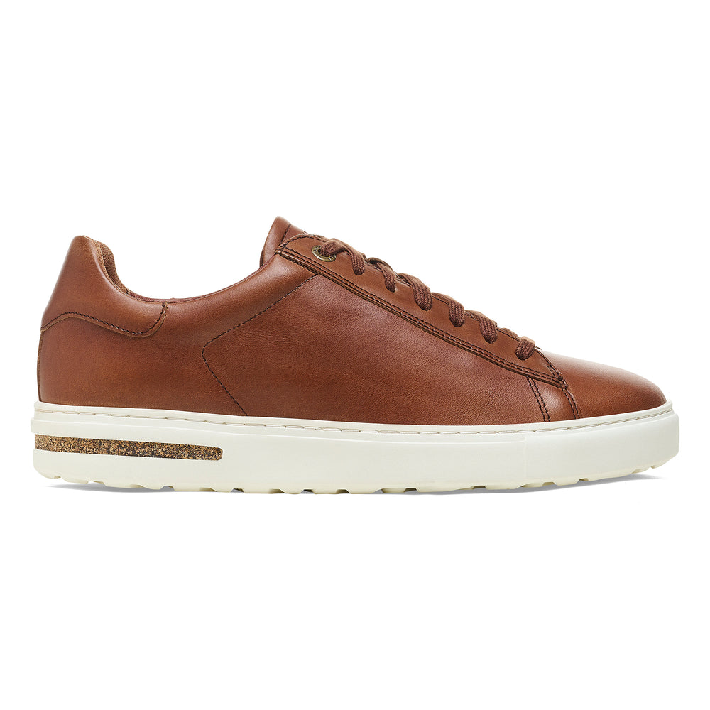 Cognac leather lace up sneaker with white sole.