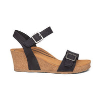 Wedge sandal with black adjustable straps.