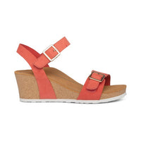 Wedge sandal with coral adjustable straps.