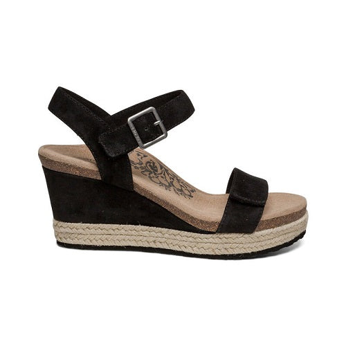 Espadrille wedge with adjustable quarter and front strap in black.