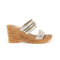 Two strap high heel slide in platinum with cork wedge.